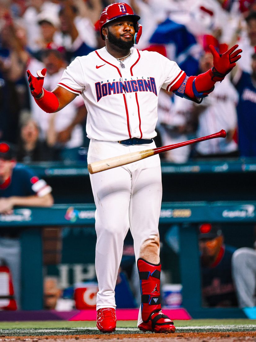 A Dominican Republic slugger shrugging after a home run