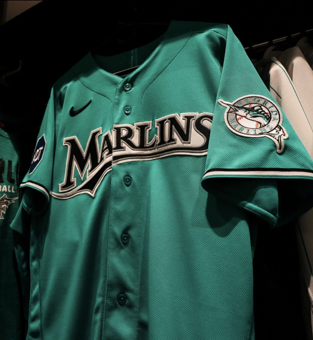 The teal Marlins throwback jersey hanging in the clubhouse