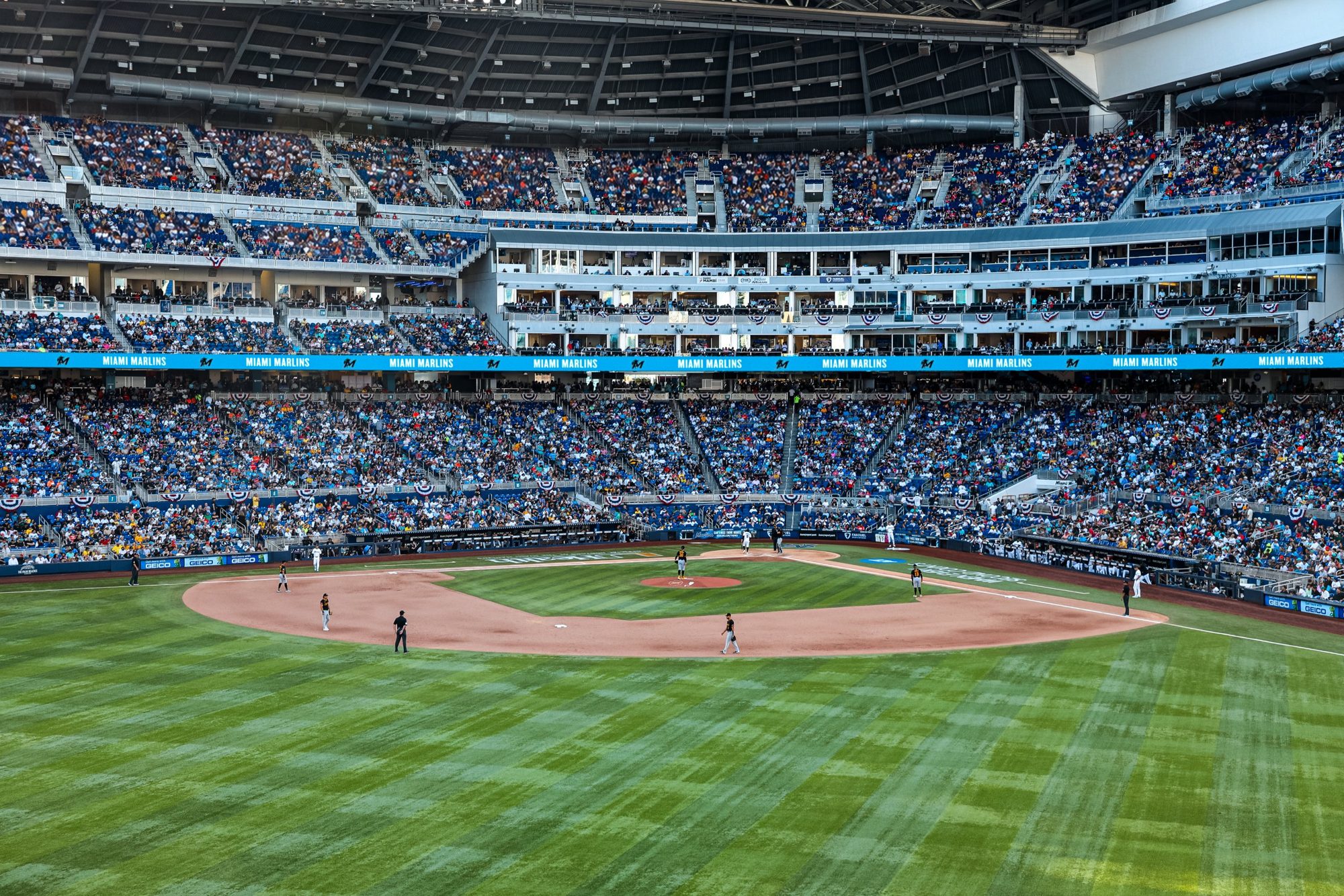 A packed loanDepot park during a Marlins game, seen from the outfield