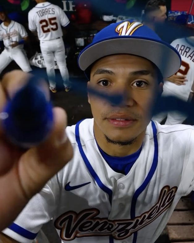 A Marlins player in Venezuela’s dugout during the World Baseball Classic