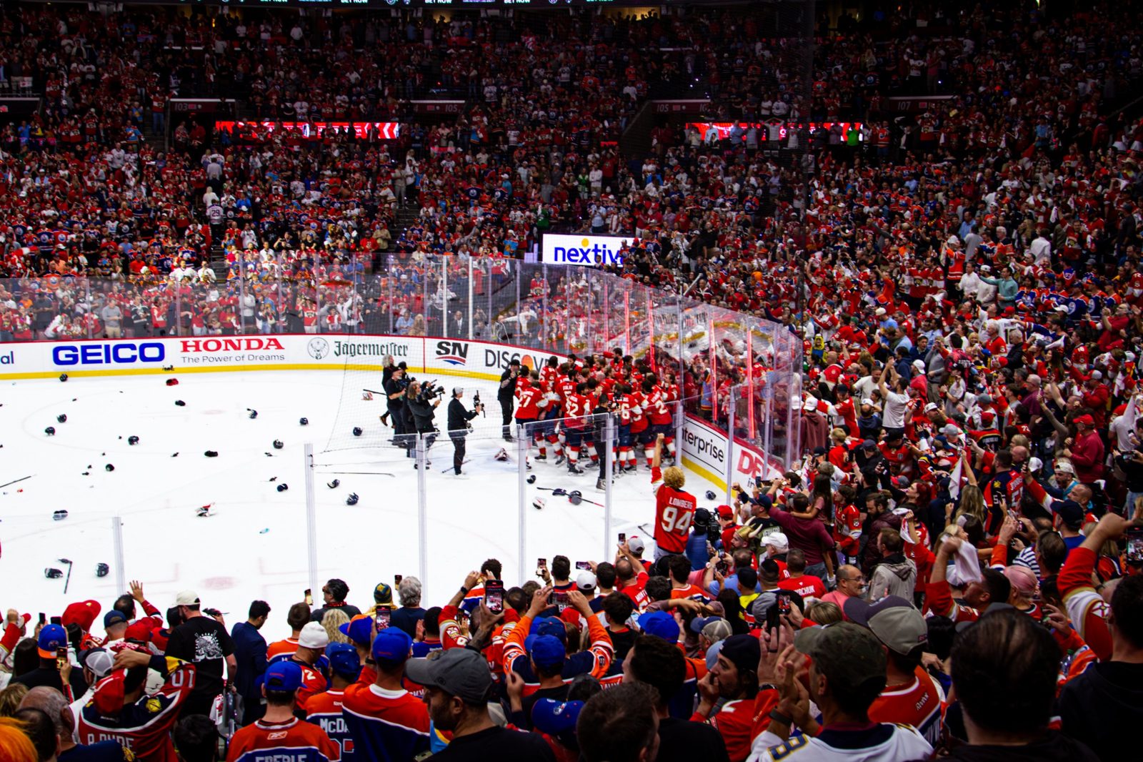 Florida Panthers celebrating on the ice as fans cheer